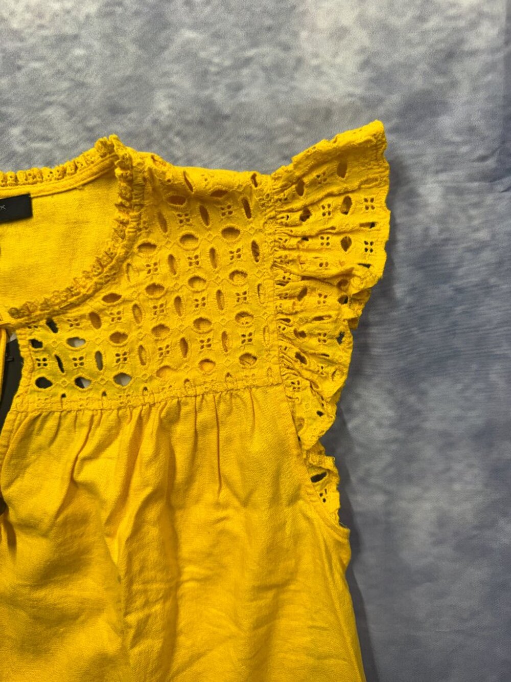 Marc New York yellow eyelet blouse features ruffled cap sleeves and a tassel tie - Picture 6 of 8